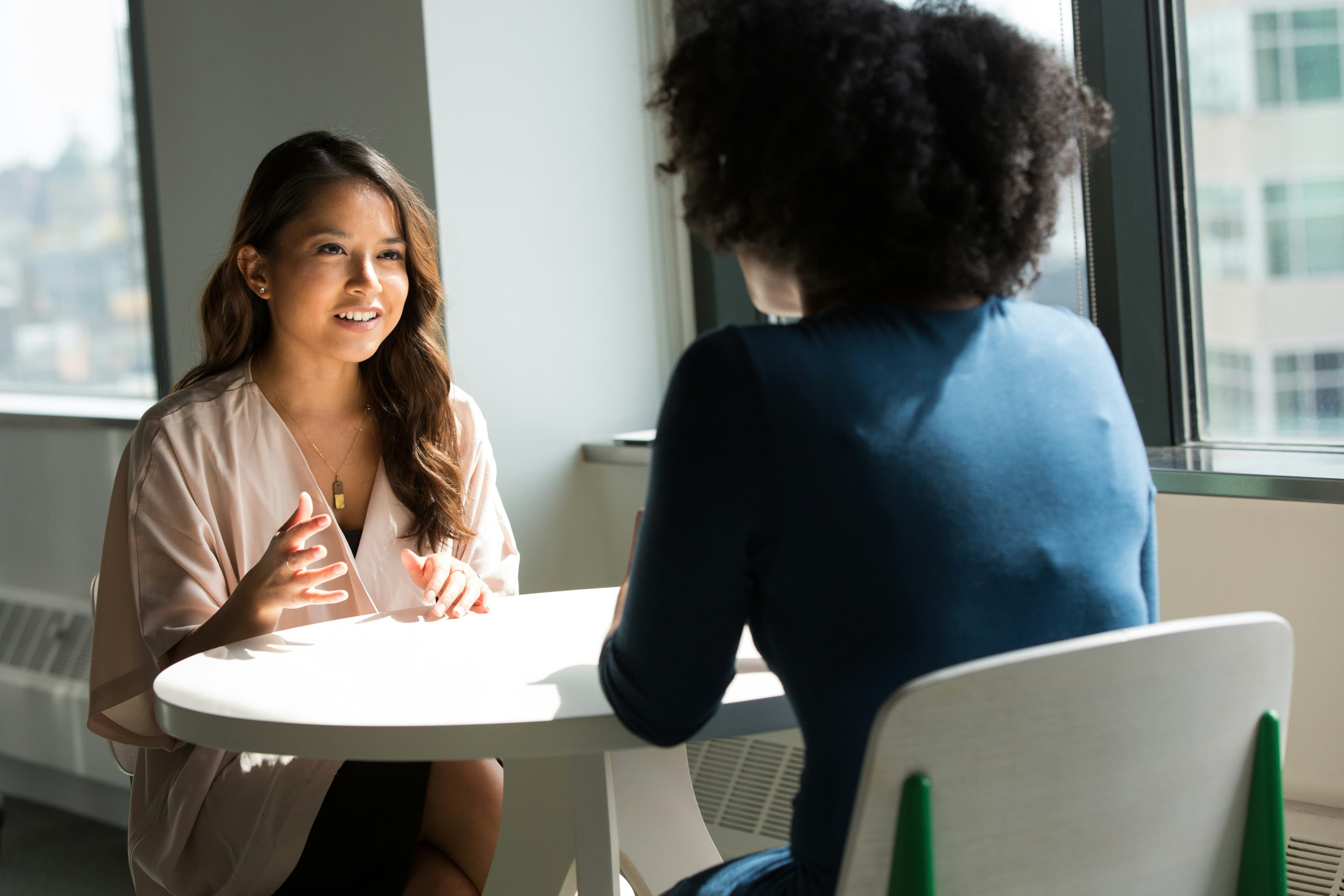 LionsCrest Acquisitions team member speaking with a community member